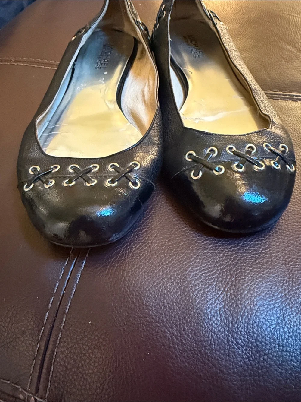 Micheal Kors black flats with grommet /leather detail sz 9.5